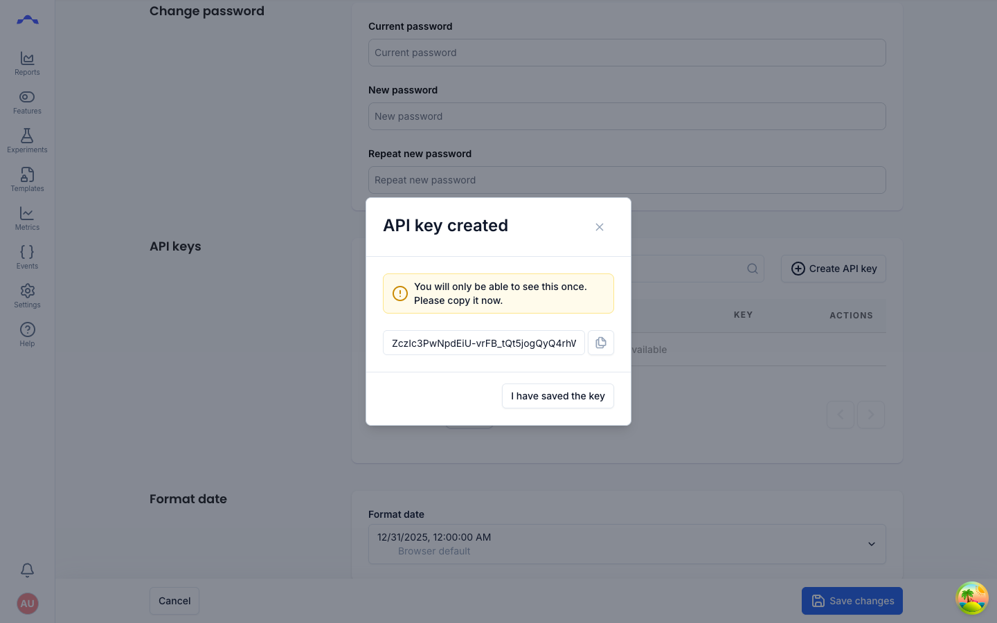 The API key created dialog, showing the raw key value with a warning that it will only be shown once, a copy button, and an 'I have saved the key' button.